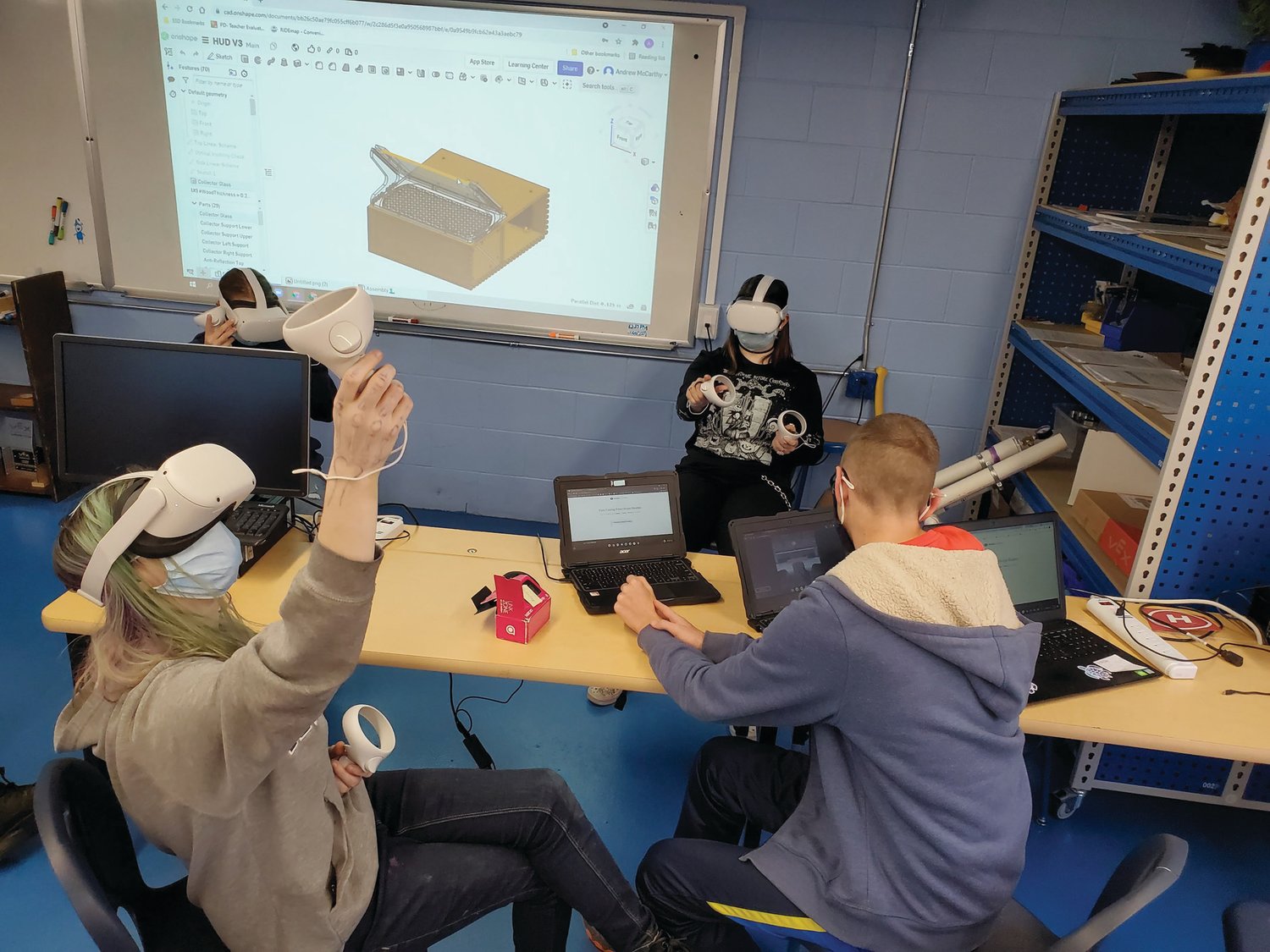 THE OTHER VIRTUAL LEARNING: Scituate students adjust a machine in a virtual reality environment. The Scituate Career & Technology Education program uses virtual reality and GIS technology to help students explore potential career options.